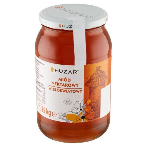 Produkt: Miód nektarowy wielokwiatowy Huzar, 1,25 kg. Przezroczysty szklany słoik z białą etykietą. Na etykiecie znajduje się nazwa produktu, logo marki Huzar oraz ilustracja ula i kwiatów. Biała zakrętka z logo.