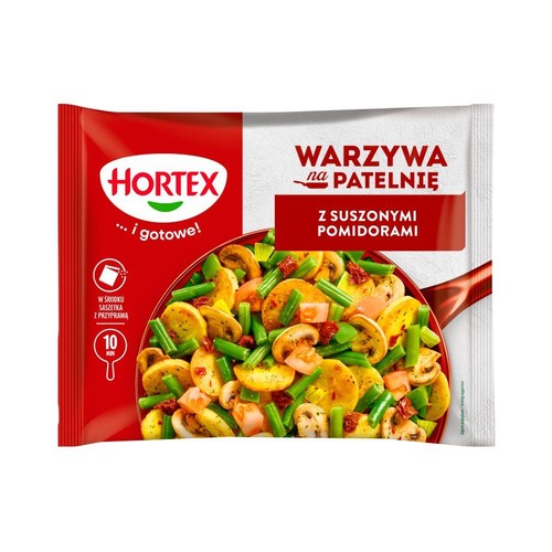 Mrożone warzywa Hortex, Warzywa na Patelnię z Suszonymi Pomidorami. Czerwono-białe opakowanie z grafiką gotowych warzyw.