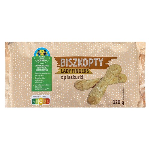 Biszkopty Lady Fingers z płaskurki, 120 g. Produkt w beżowym opakowaniu z logo Auchan Pewni Dobrego. Na etykiecie informacja o zrównoważonej produkcji, prostym składzie i wysokiej zawartości błonnika pokarmowego. Widoczne dwa biszkopty.