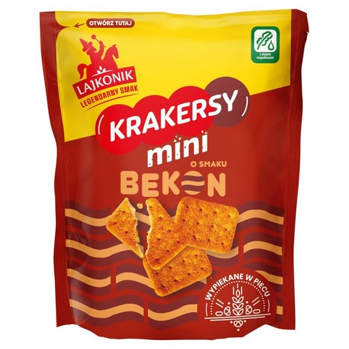 Lajkonik Krakersy mini o smaku bekonu w czerwono-żółtym opakowaniu. Widoczne są chrupiące krakersy.