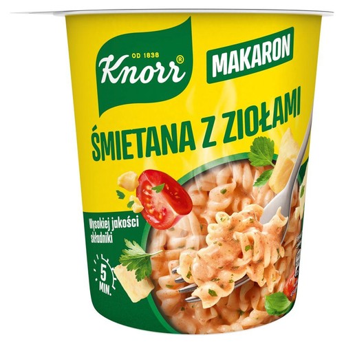 Żółty kubek Knorr z makaronem śmietanowym z ziołami. Na opakowaniu grafika gotowego dania z pomidorami i serem. Gotowe w 5 min.