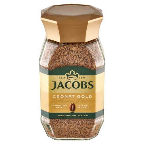 Kawa Jacobs Cronat Gold w szklanym słoiku. Na etykiecie widnieje nazwa produktu, "Harmonijny smak" i "Pełnia aromatu".