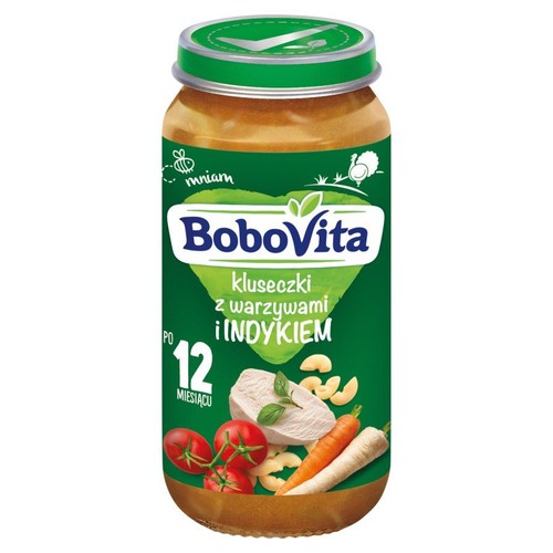 Słoik BoboVita, danie dla niemowląt po 12 miesiącu. Na zielonej etykiecie grafiki indyka, warzyw i kluseczek.