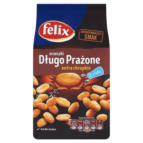 Felix Orzeszki Długo Prażone z Solą, extra chrupkie. Czarna paczka z brązowym tłem i grafiką orzeszków. Produkt to źródło białka.