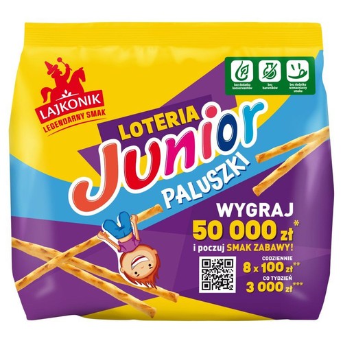 Żółto-fioletowe opakowanie paluszków Lajkonik Junior z loterią. Widoczne hasło "Wygraj 50 000 zł". Produkt bez dodatku konserwantów, barwników i wzmacniaczy smaku.