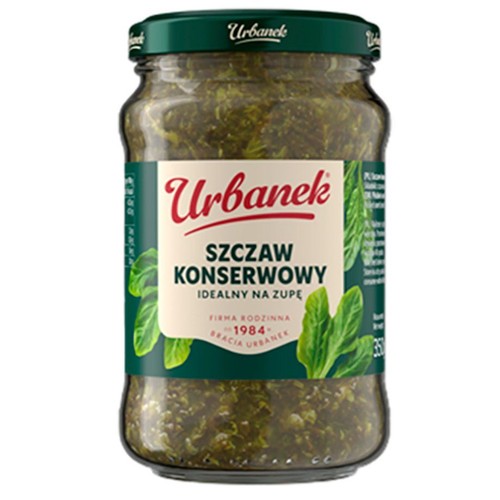 Słoik szczawiu konserwowego Urbanek, 350g. Na etykiecie z zielonym tłem i grafiką liści szczawiu widnieje napis "Szczaw Konserwowy Idealny na zupę". Zakrętka słoika jest zielona. Produkt firmy rodzinnej Bracia Urbanek, założonej w 1984 roku.
