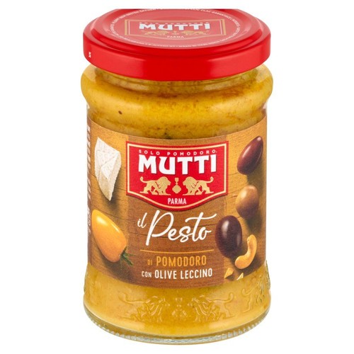 Słoik pesto pomidorowego Mutti z oliwkami Leccino. Na etykiecie grafiki sera, pomidora, oliwek i orzecha nerkowca. Czerwona zakrętka.