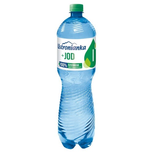 Woda Ustronianka + JOD w przezroczystej plastikowej butelce o pojemności 1 litra. Butelka ma zieloną nakrętkę. Na białej etykiecie z zielonymi elementami widnieje napis "Ustronianka + JOD" oraz informacja o 100% dziennego zapotrzebowania na jod w 1 L.