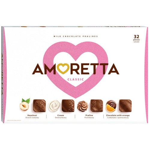 Produkt Amoretta Classic, pudełko 32 mlecznych pralin. Na białym tle dominuje różowe serce z nazwą "AMORETTA CLASSIC". Pod spodem graficzne przedstawienie czterech rodzajów pralin: z orzechem laskowym, śmietankowe, pralinkowe oraz czekoladowe z pomarańczą.