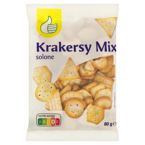 Biała torebka Krakersy Mix solone 80g. Na górze opakowania żółty symbol kciuka w górę. Przezroczyste okienko ukazuje różnorodne kształty słonych krakersów: okrągłe, trójkątne, sześciokątne i prostokątne.