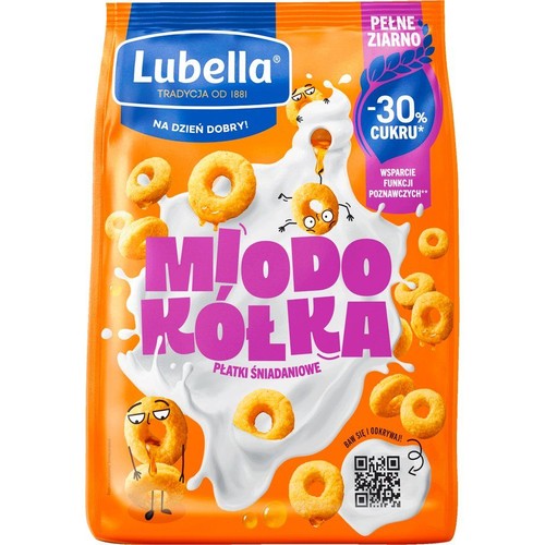 Opakowanie płatków śniadaniowych Lubella Miodowe Kółka, z napisem "Tradycja od 1881". Przedstawia złote kółka zbożowe w mleku, niektóre z zabawnymi minami. Produkt z pełnego ziarna, o obniżonej zawartości cukru.