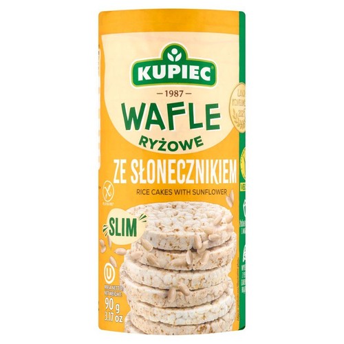 Opakowanie wafli ryżowych Kupiec ze słonecznikiem, 90g. Na etykiecie stos wafli z widocznymi ziarnami słonecznika.