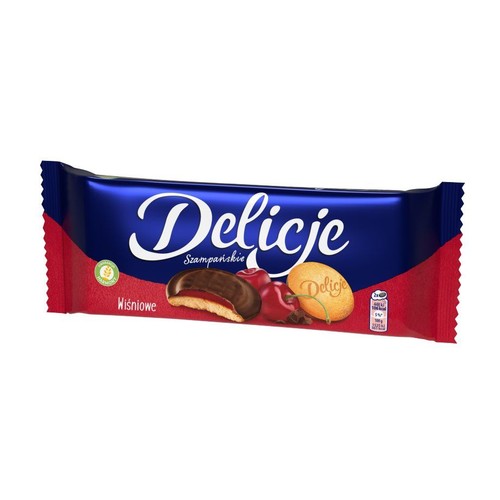 Czerwono-niebieskie opakowanie ciastek Delicje Szampańskie o smaku wiśniowym. Widoczne ciastko z czekoladą i wiśniami.