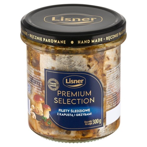 Słoik Lisner Premium Selection z filetami śledziowymi z kapustą i grzybami. Widoczne kawałki ryby, kapusty i grzybów. Czarna zakrętka z napisem "Lisner" i "Ręcznie pakowane". Masa netto 300g.
