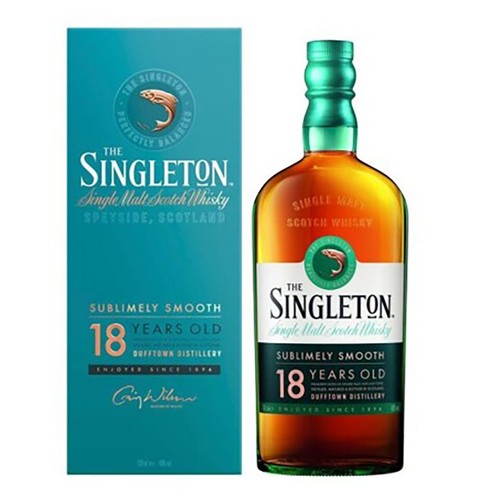 Whisky The Singleton 18 Years Old, Single Malt Scotch Whisky, 700 ml, 40% obj. Butelka z zieloną zakrętką i etykietą z logo ryby. Obok turkusowe pudełko z napisem "Idealnie zbalansowana" i "Niezwykle gładka".