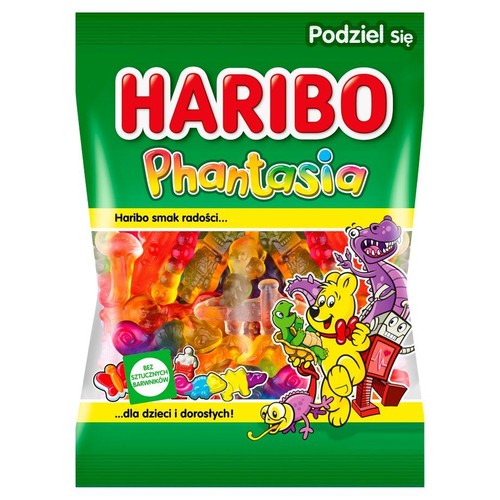 Zielona torebka żelków Haribo Phantasia z przezroczystym okienkiem, przez które widać kolorowe żelki w kształcie zwierząt i fantazyjnych postaci. Na opakowaniu napis "Podziel się" i "Bez sztucznych barwników".