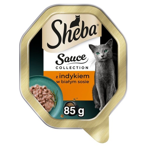 Tacka karmy dla kota Sheba Sauce Collection, 85g. Złoto-czarne opakowanie z grafiką karmy z indykiem i kota.