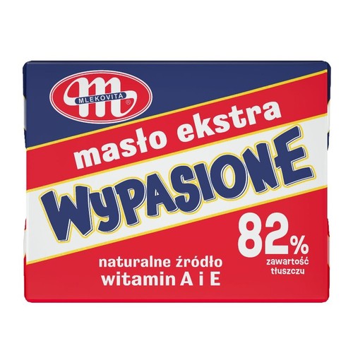 Masło ekstra WYPASIONE marki MLEKOVITA w prostokątnym opakowaniu. Na granatowo-czerwonym tle widnieje napis "masło ekstra WYPASIONE" oraz informacja o 82% zawartości tłuszczu. Produkt jest naturalnym źródłem witamin A i E.