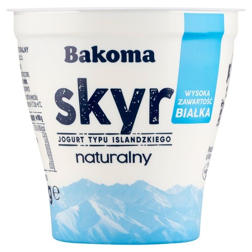Opakowanie jogurtu Bakoma Skyr naturalny. Biały kubek z niebieskimi elementami i informacją o wysokiej zawartości białka.