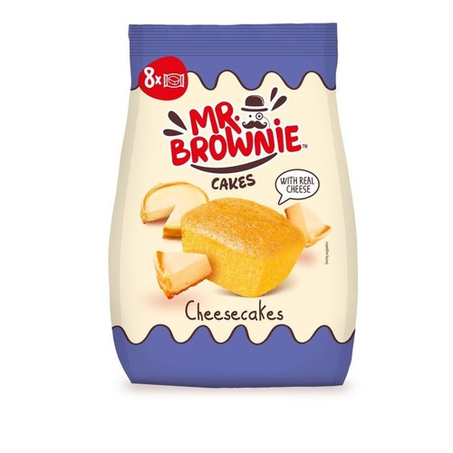 Opakowanie Mr. Brownie Cakes Cheesecakes, 8 sztuk. Białe tło z fioletowymi, falistymi brzegami. Centralnie umieszczona grafika przedstawia podłużne ciastko i kawałki sernika. Etykieta informuje o "prawdziwym serze".