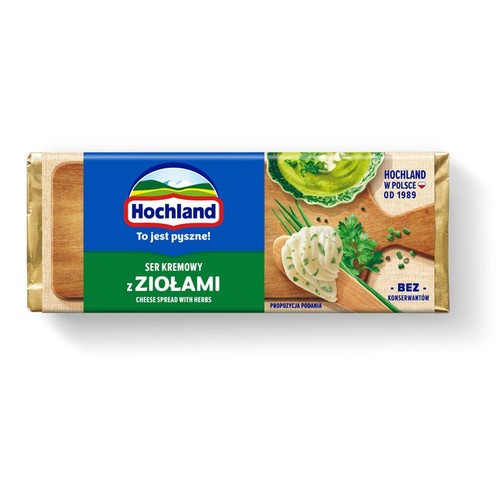 Opakowanie sera kremowego Hochland z ziołami. Na etykiecie widoczna propozycja podania z natką pietruszki i szczypiorkiem.