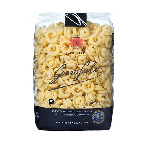 Duże, przezroczyste opakowanie makaronu Garofalo Cappelletti o wadze 500g. Makaron ma kształt małych, zwiniętych pierścieni. Na opakowaniu widnieje logo Garofalo i informacja o pochodzeniu: Makaron z Gragnano od 1789.