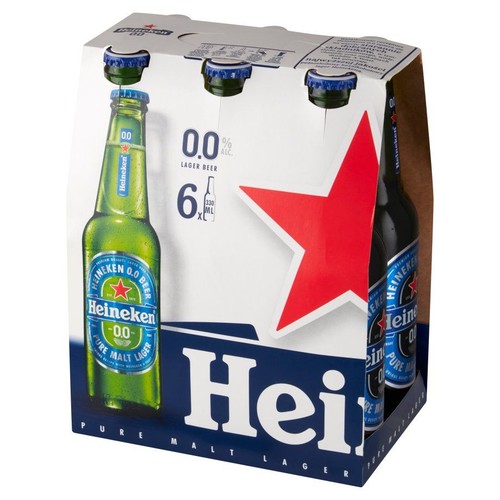 Sześciopak piwa Heineken 0.0, bezalkoholowy lager, w zielonych butelkach 330 ml, w białym kartonowym opakowaniu z czerwoną gwiazdą.
