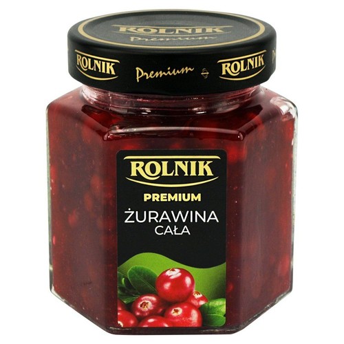 Produkt Rolnik Premium: żurawina cała w szklanym słoiku. Widoczne czerwone owoce i czarna etykieta.