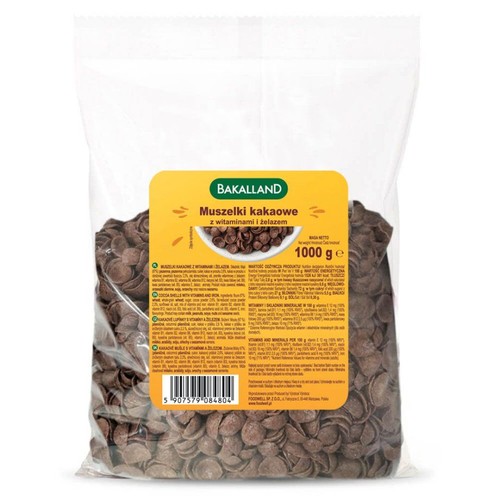 Bakalland Muszelki kakaowe z witaminami i żelazem, 1000 g. Przezroczysta torba z brązowymi płatkami.