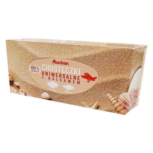 Pudełko chusteczek Auchan, uniwersalne z balsamem, 100% celulozy, 3 warstwy, 90 sztuk. Opakowanie w piaskowym kolorze z muszelkami.