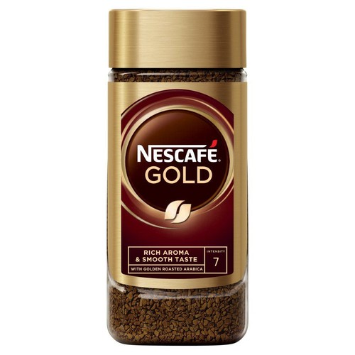 Słoik kawy NESCAFÉ GOLD, intensywność 7. Złota etykieta z brązowym okręgiem i białym logo.