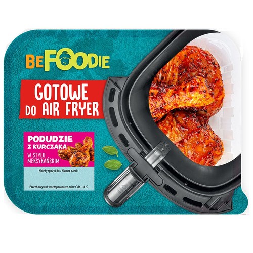 BeFoodie, podudzia z kurczaka meksykańskie, gotowe do Air Fryer. Widoczne upieczone mięso w koszu frytkownicy.