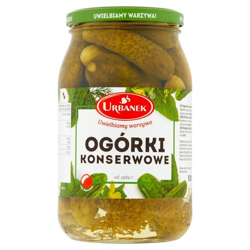 Słoik ogórków konserwowych Urbanek, 920g. Zielona zakrętka z napisem "Uwielbiamy warzywa". Biała etykieta z nazwą produktu.