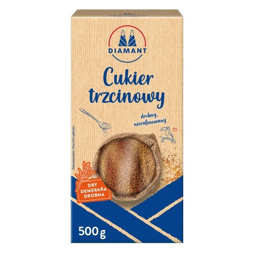 Cukier trzcinowy Diamant, drobny Demerara, 500 g. Brązowe opakowanie z niebieskimi akcentami. Widoczna grafika cukru.