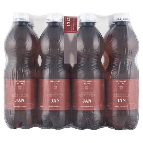 Opakowanie zbiorcze 12 butelek wody leczniczej Kryniczanka Jan, 500 ml każda. Butelki z białymi zakrętkami, etykiety w kolorze bordowym z białym napisem "JAN" i "WODA LECZNICZA".