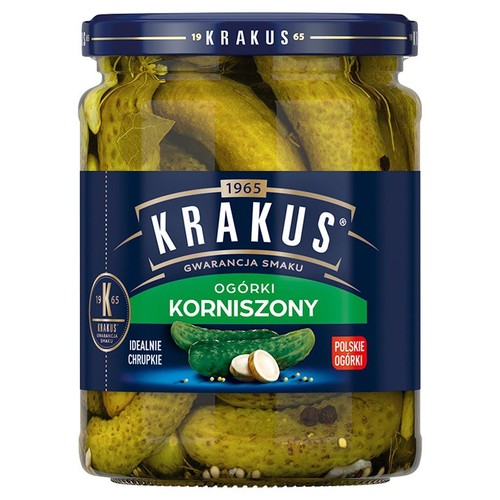 Krakus Ogórki Korniszony w szklanym słoiku. Etykieta podkreśla "Idealnie Chrupkie".