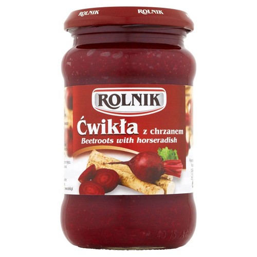 Produkt spożywczy: ćwikła z chrzanem w przezroczystym słoiku. Etykieta w kolorze czerwonym z białym napisem "Ćwikła z chrzanem" i grafiką buraków oraz chrzanu. Czerwona zakrętka z napisem Rolnik.