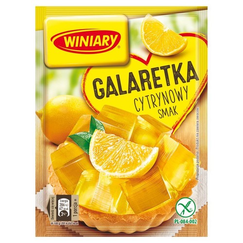 Produkt Winiary Galaretka Cytrynowy Smak w żółtej saszetce. Na opakowaniu znajduje się apetyczna grafika: mała tarta z żółtą galaretką, plasterkiem cytryny i zielonymi listkami. Widoczny napis "Propozycja podania".