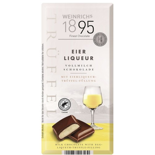 Opakowanie czekolady mlecznej Weinrichs 1895 z nadzieniem truflowym z likierem jajecznym. Na grafice przełamana kostka czekolady i kieliszek z likierem. Produkt certyfikowany Rainforest Alliance. Zawiera alkohol.