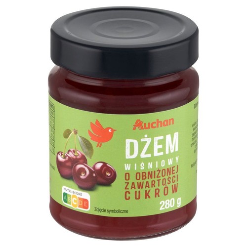 Słoik dżemu wiśniowego Auchan o obniżonej zawartości cukru, 280 g. Zielona etykieta z wiśniami i ptakiem.