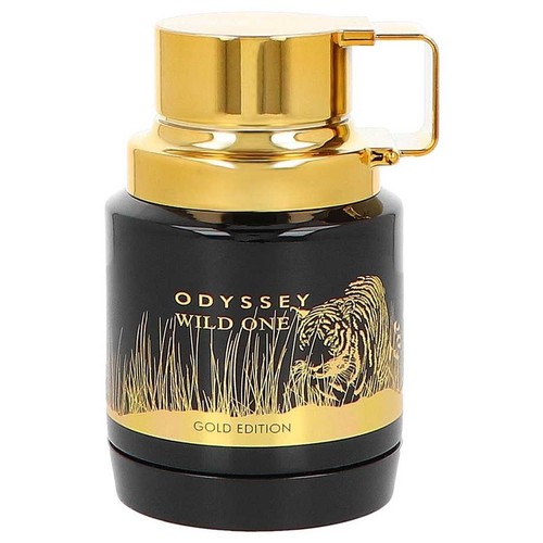Flakon perfum "ODYSSEY WILD ONE GOLD EDITION" o pojemności nieokreślonej, w kształcie walca. Butelka jest czarna, a jej górna część i nakrętka są złote. Na etykiecie znajduje się złota ilustracja tygrysa w trawie.