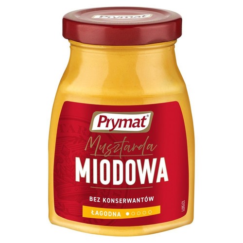 Słoik musztardy miodowej Prymat z czerwoną etykietą i nakrętką. Musztarda jest łagodna i bez konserwantów.
