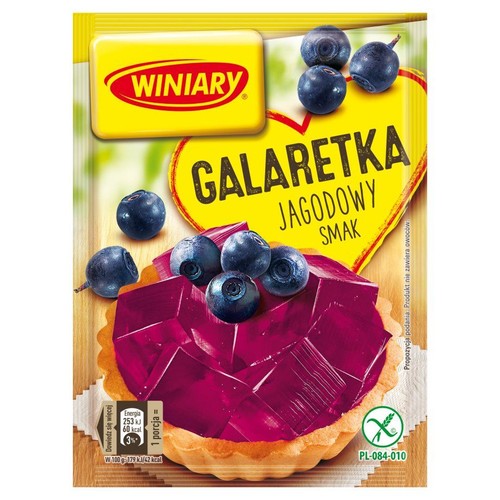 Saszetka galaretki Winiary z napisem "Jagodowy Smak". Na opakowaniu widnieje ilustracja deseru: krucha tartaletka z fioletową galaretką i kilkoma jagodami. Podpis "Propozycja podania. Produkt nie zawiera owoców." jest widoczny.