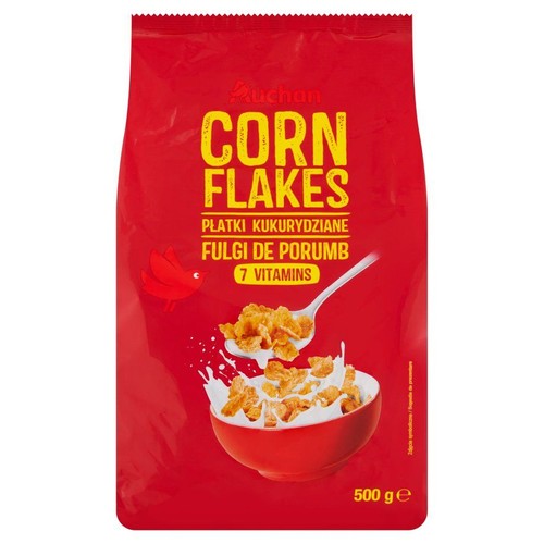 Opakowanie płatków kukurydzianych Auchan Corn Flakes z 7 witaminami, 500 g. Widoczna grafika miski z mlekiem.