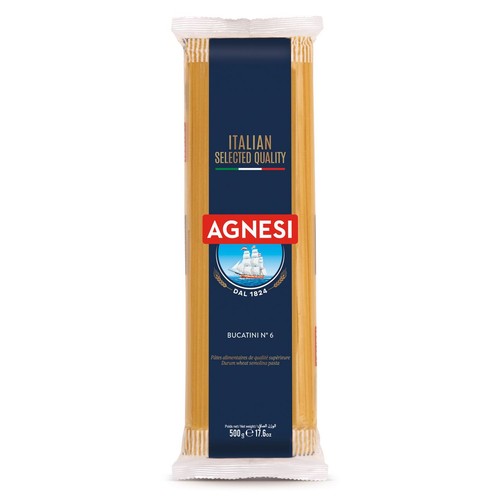 Włoski makaron Agnesi Bucatini N° 6, 500g. Etykieta w kolorze granatowym z czerwonym logo Agnesi. Zawiera informację o wyselekcjonowanej jakości i dacie "DAL 1824" oraz grafikę żaglowca.