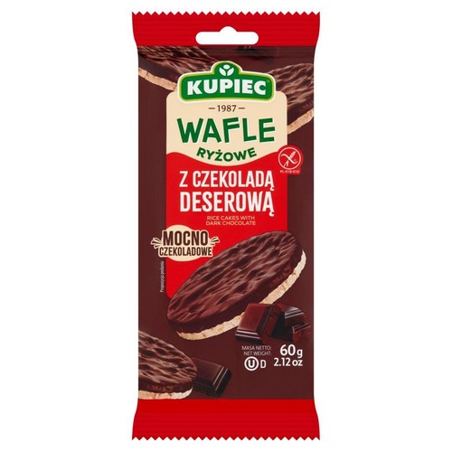 Czerwono-brązowe opakowanie wafli ryżowych Kupiec z ciemną czekoladą deserową. Na opakowaniu widoczne są dwa wafle ryżowe obficie pokryte ciemną czekoladą oraz kilka kostek czekolady. Produkt jest mocno czekoladowy. Masa netto 60g.