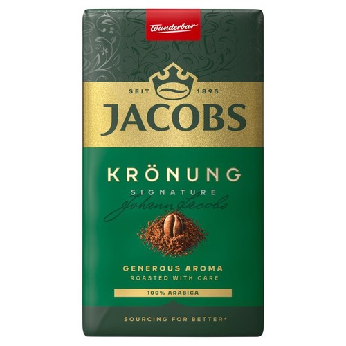 Kawa Jacobs Krönung Signature, 100% Arabica. Zielone opakowanie z ozdobnym złotym pasem i napisem "Wspaniały".